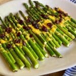 Cheesy balsamic asparagus on serving platter