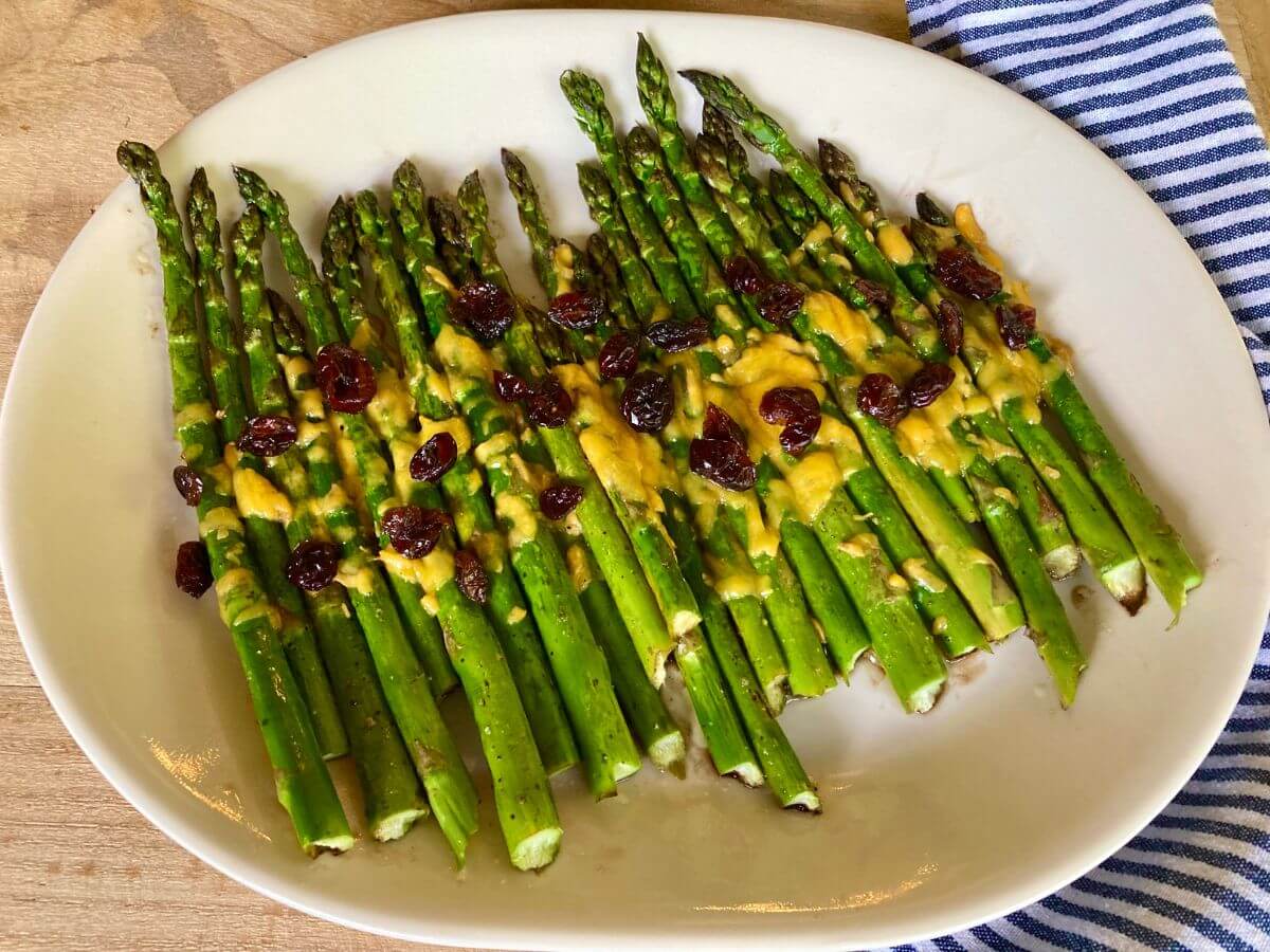 Cheesy balsamic asparagus on serving platter