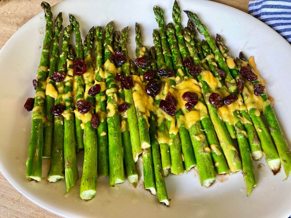 Cheesy balsamic asparagus on serving platter