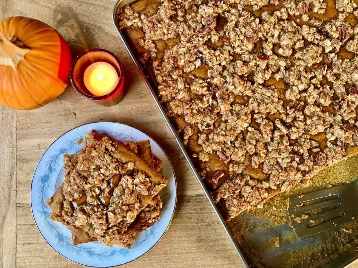 Slices of Pumpkin Crisp Sheet-Pan Pancakes on plate and on pan