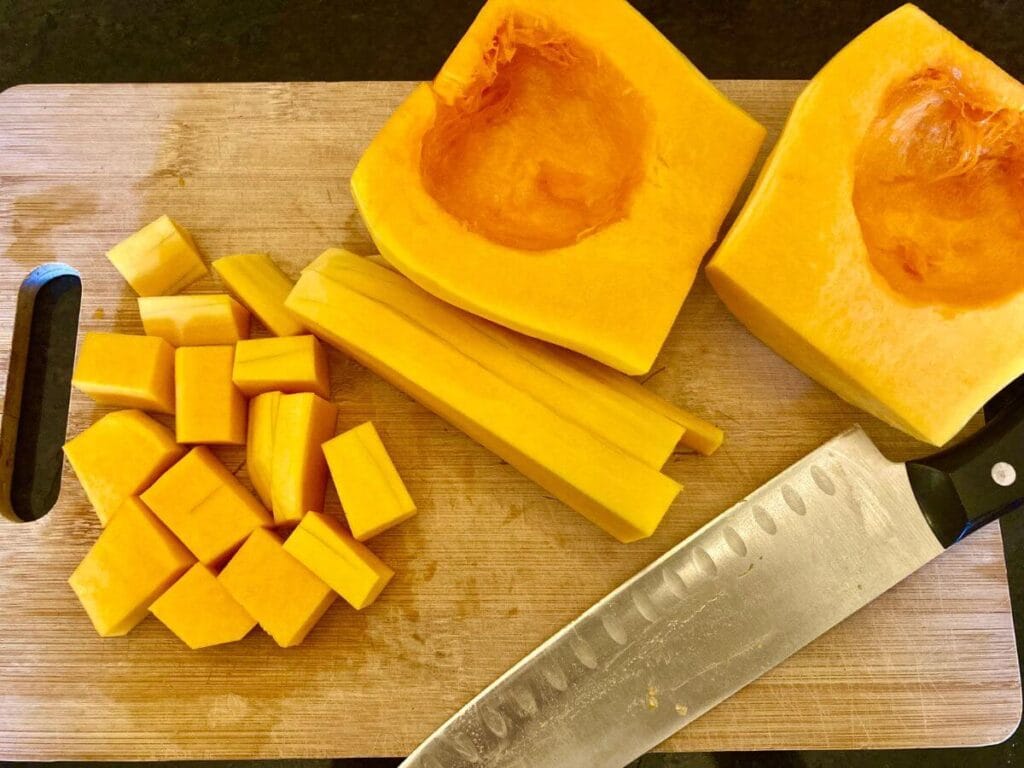 Roasted Brussels Sprouts and Butternut Squash Cutting butternut squash into cubes