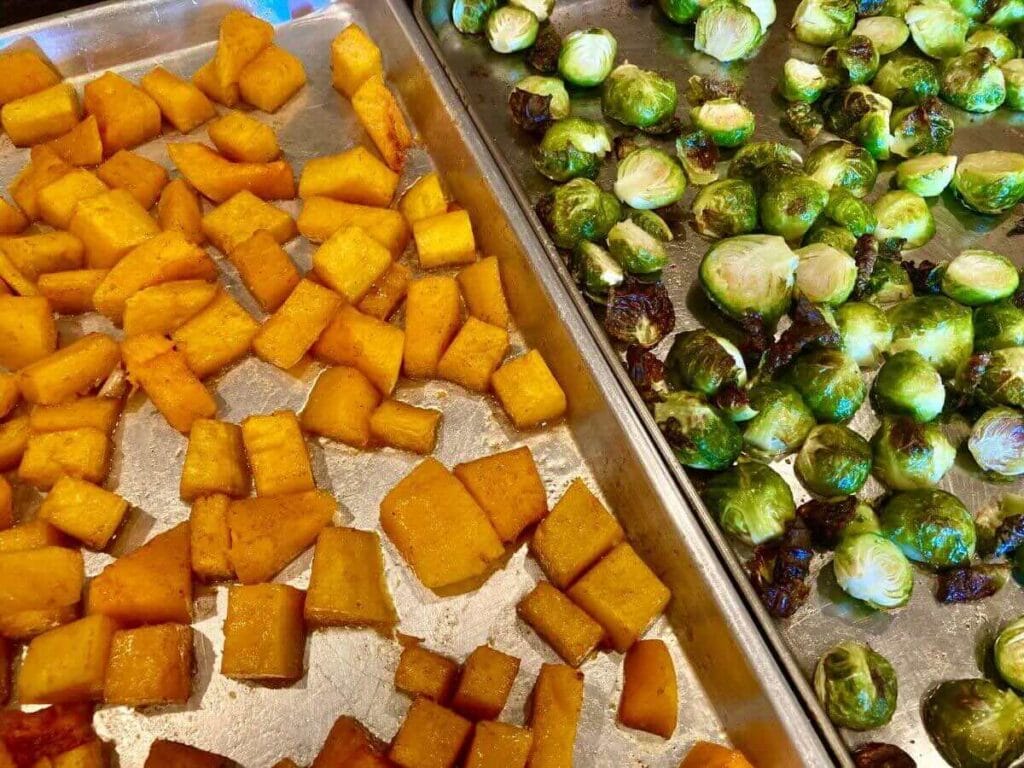 Roasted Brussels Sprouts and Butternut Squash 2 sheet pans with roasted butternut squash and Brussels sprouts