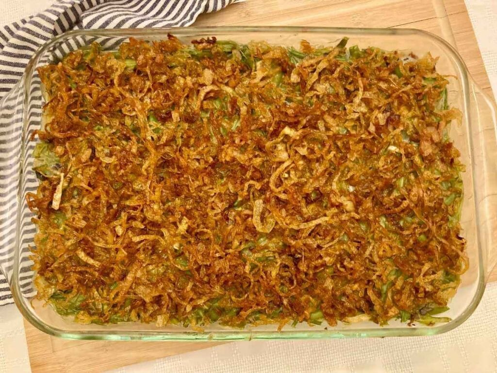 green bean casserole on wooden cutting board