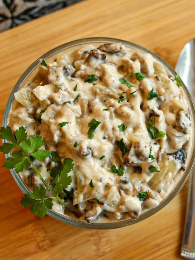 Top view of homemade condensed cream of mushroom soup on a wooden table.