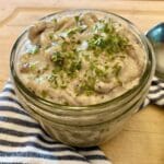 Gluten-free cream of mushroom soup in jar with spoon