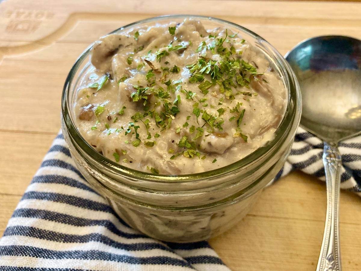 Gluten-free cream of mushroom soup in jar with spoon