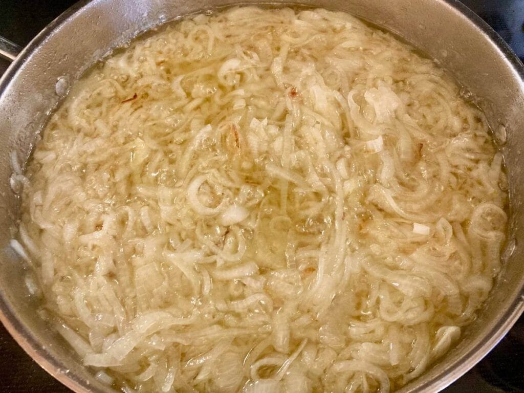 Onion slices frying in oil