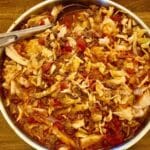 Skillet with cabbage roll in a bowl