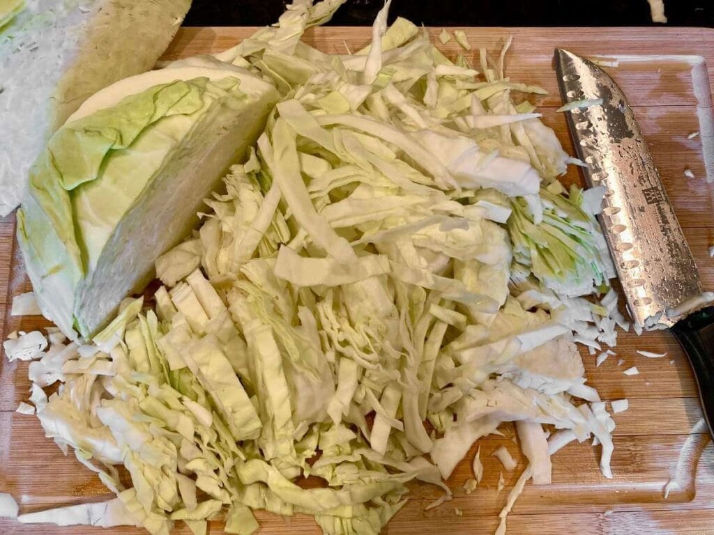 Slicing cabbage on cutting board
