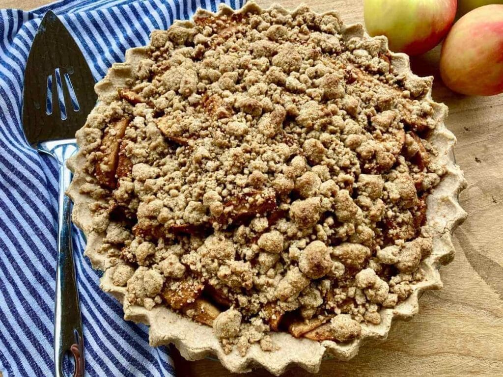 Side angle of gluten-free dutch apple pie with gluten-free crumb topping