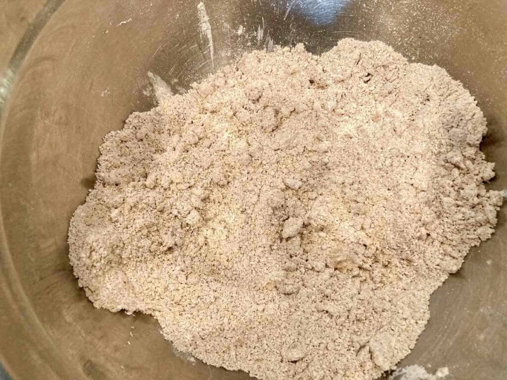 Cutting coconut oil into pie crust ingredients