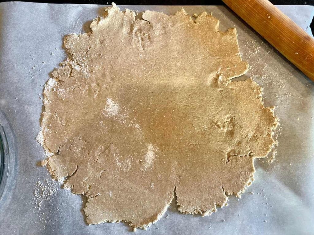 Rolling out oat flour pie crust