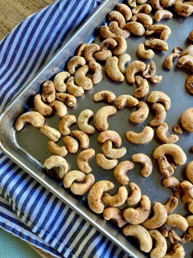 Close-up of roasted cashews on baking sheet