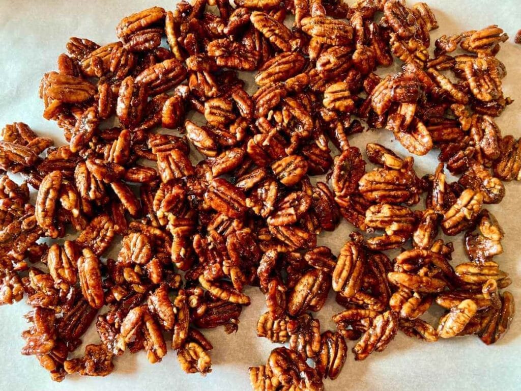 Candied pecans on parchment paper