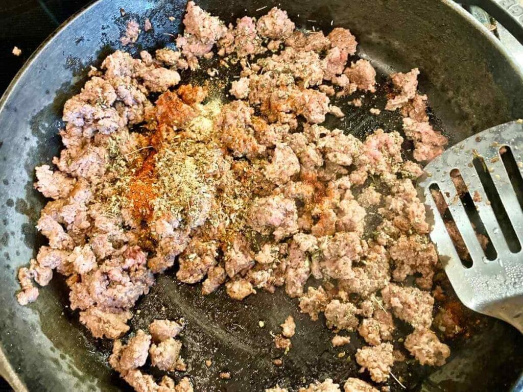 Stirring beef into egg mixture