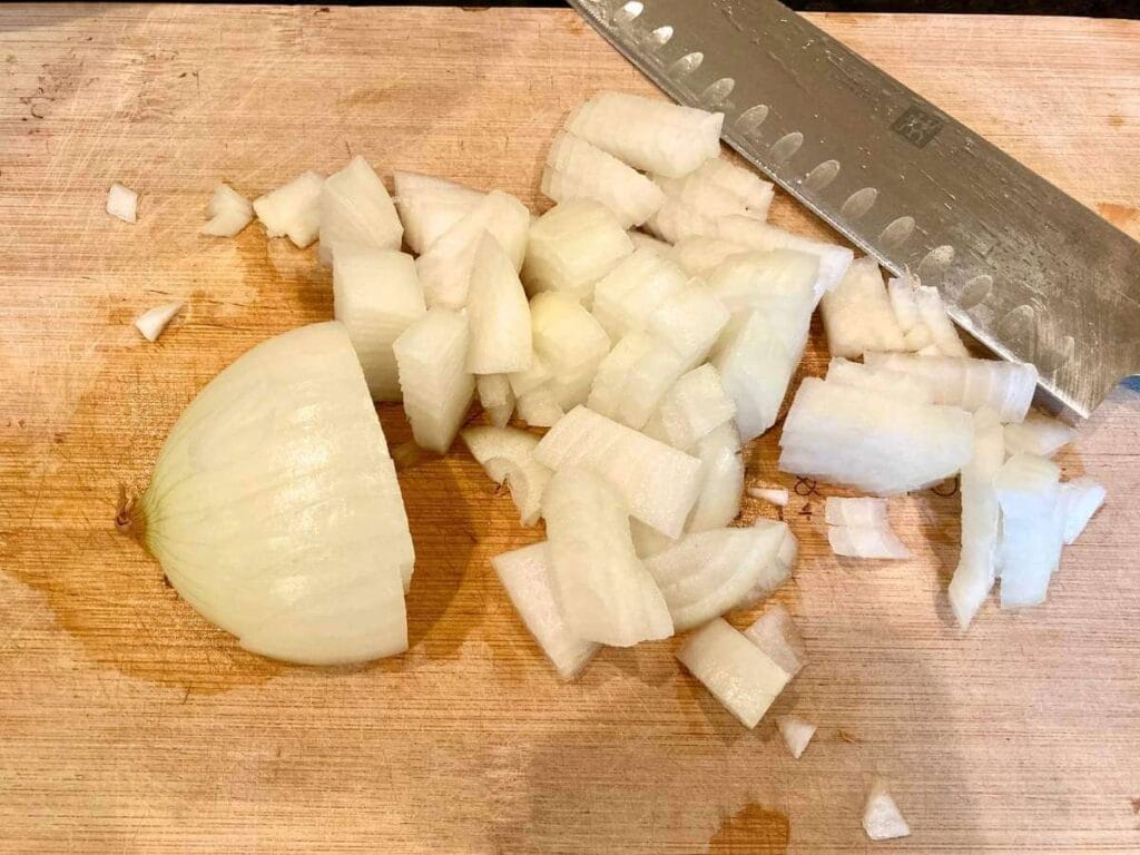 Dicing onion on a cutting board