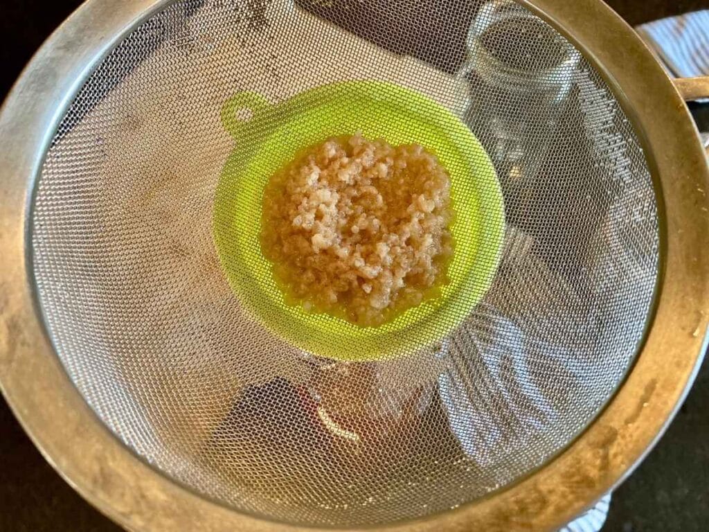 Water kefir grains in strainer