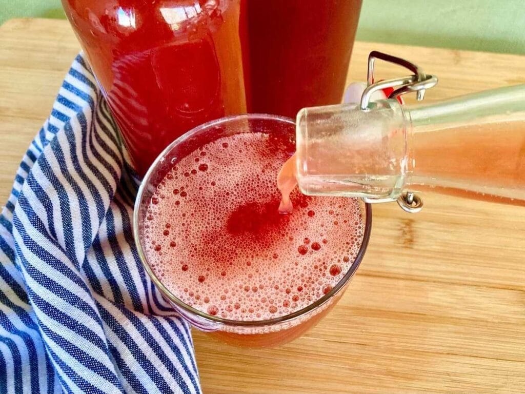 Pouring water kefir into glass