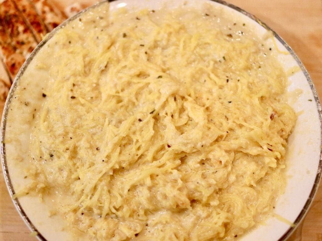 Spaghetti squash with parmesan cheese sauce in a bowl