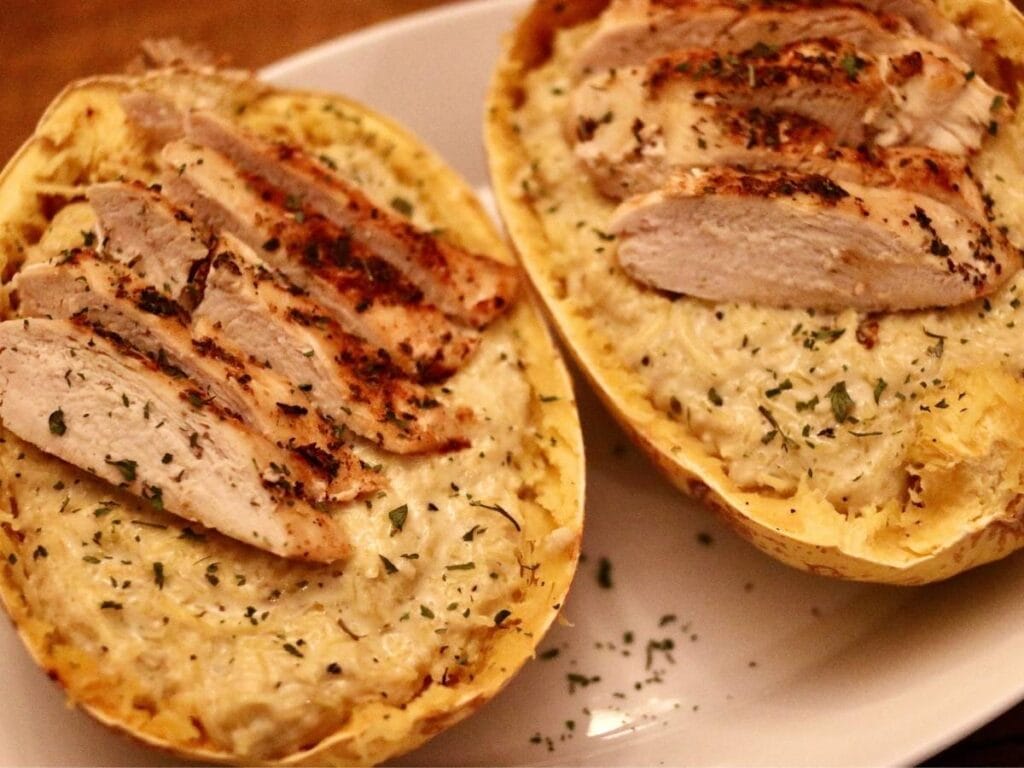 2 squash shells with chicken Alfredo spaghetti squash inside
