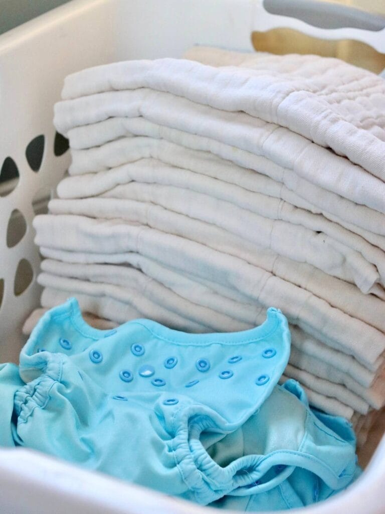 Cloth diapers in a laundry basket.