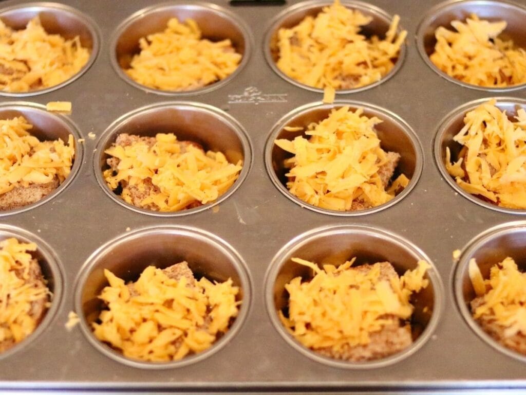 Adding cheese to muffin cups