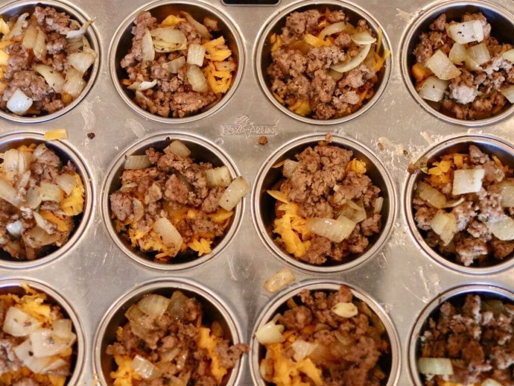 Adding ground beef to muffin cups