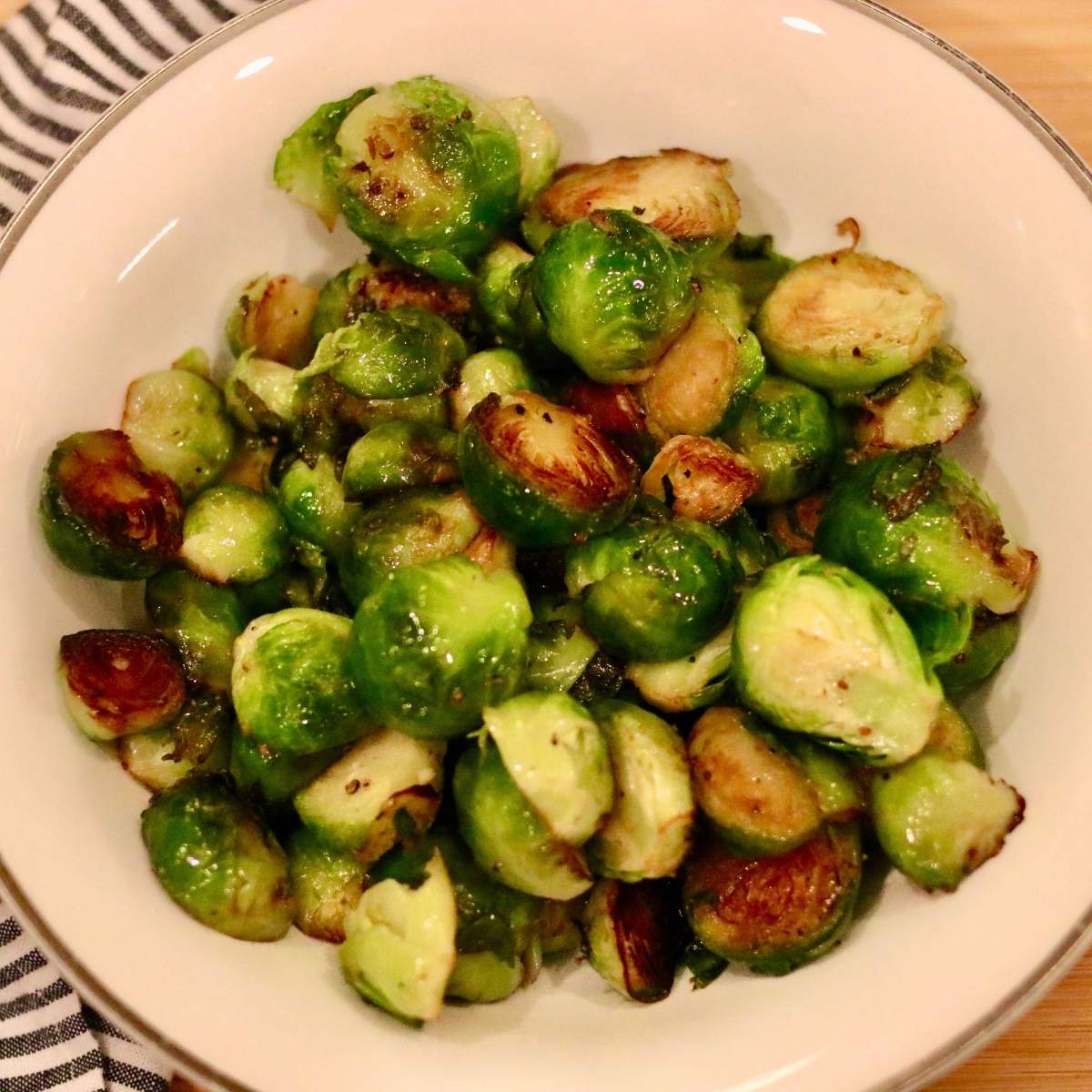 Closeup of stovetop Brussels sprouts in a bowl