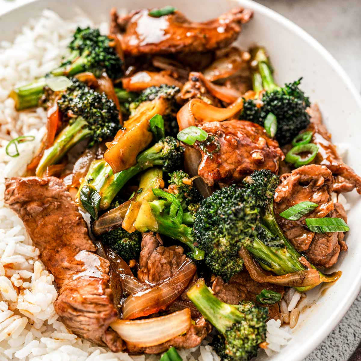 beef and broccoli with rice on a plate