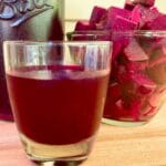 Beet kvass in a drinking glass.