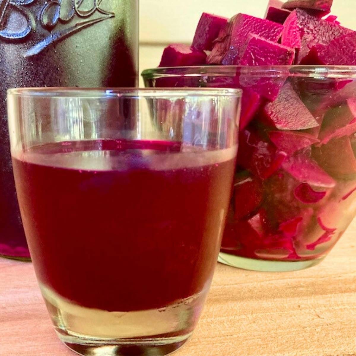 Beet kvass in a drinking glass.