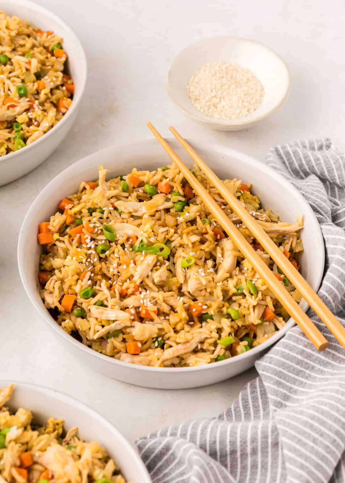 chicken fried rice in a bowl with chopsticks