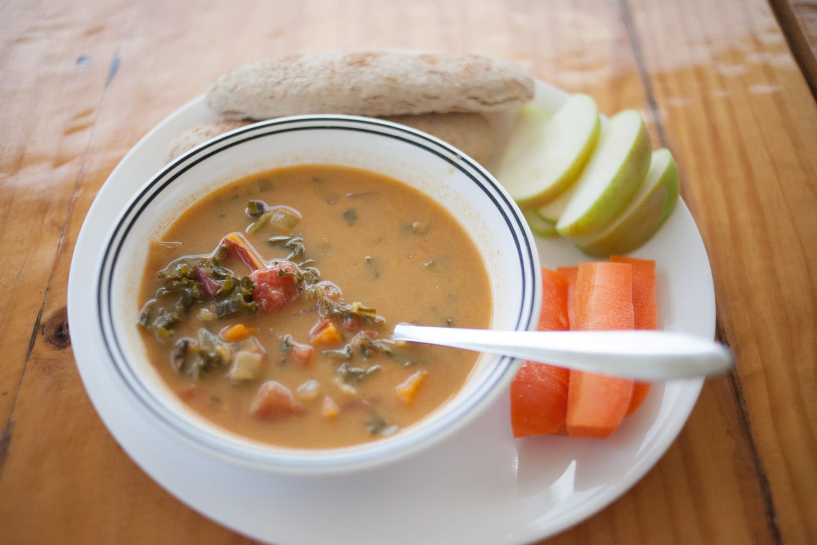 lentil soup on a plate with vegetables