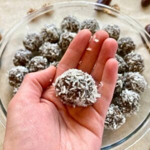 Closeup of hand holding energy ball with dates.