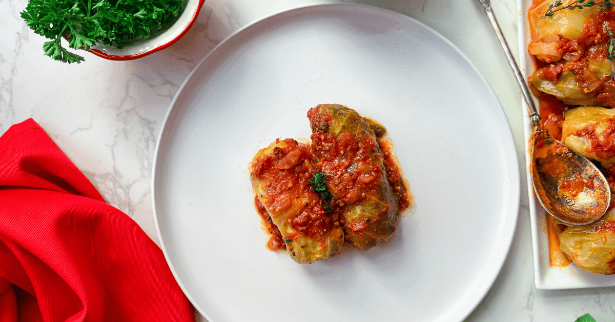 two stuffed cabbage rolls on a plate