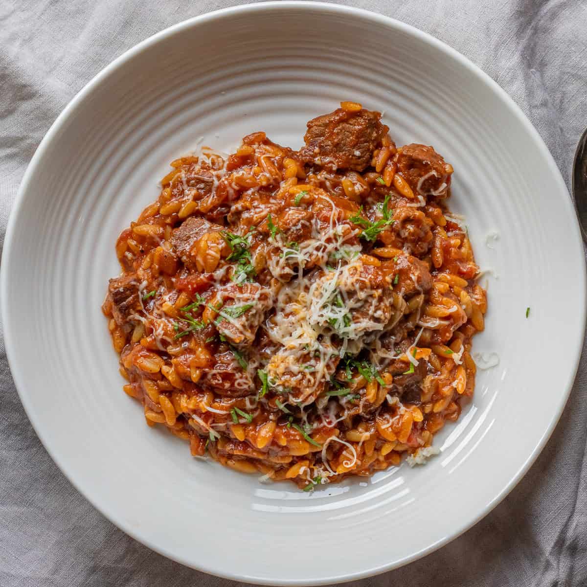 Greek beef and orzo stew in bowl