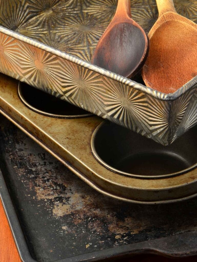 Stack of aluminum and non-stick bakeware.