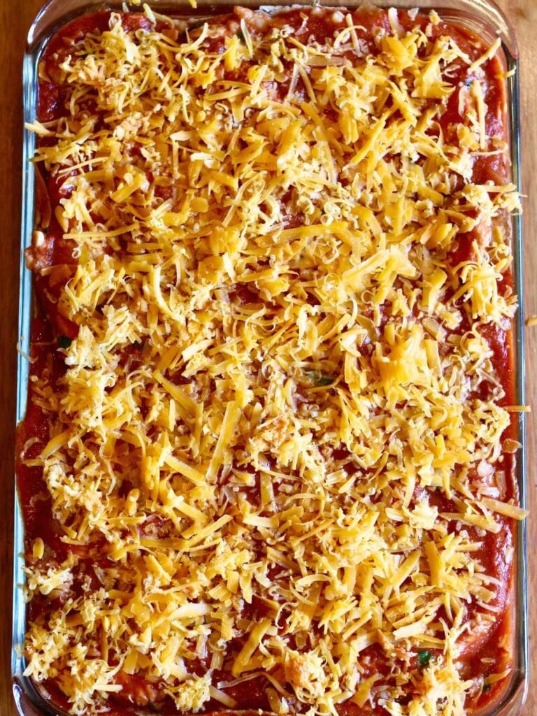 Chicken enchilada casserole before baking.