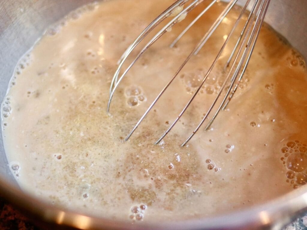 Whisking wet ingredients for cupcakes.