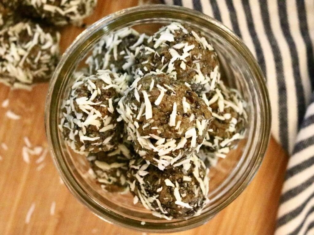 Top view of jar of oat-free protein balls with dates.