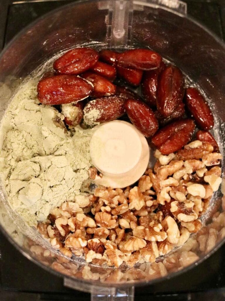 Oat-free protein balls with dates ingredients in a food processor.
