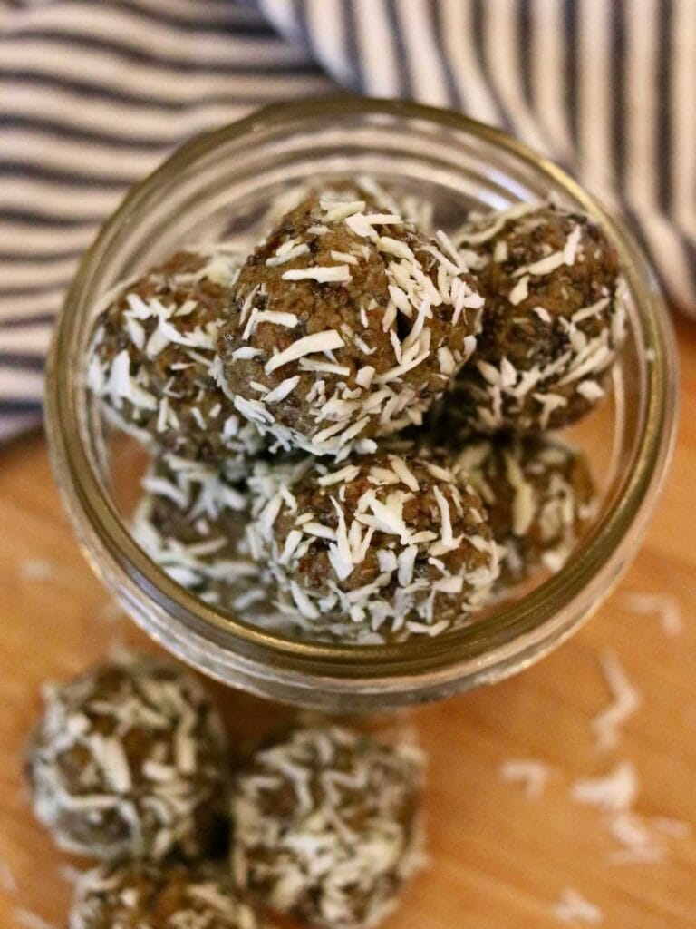 Oat-free protein balls with dates in a mason jar.