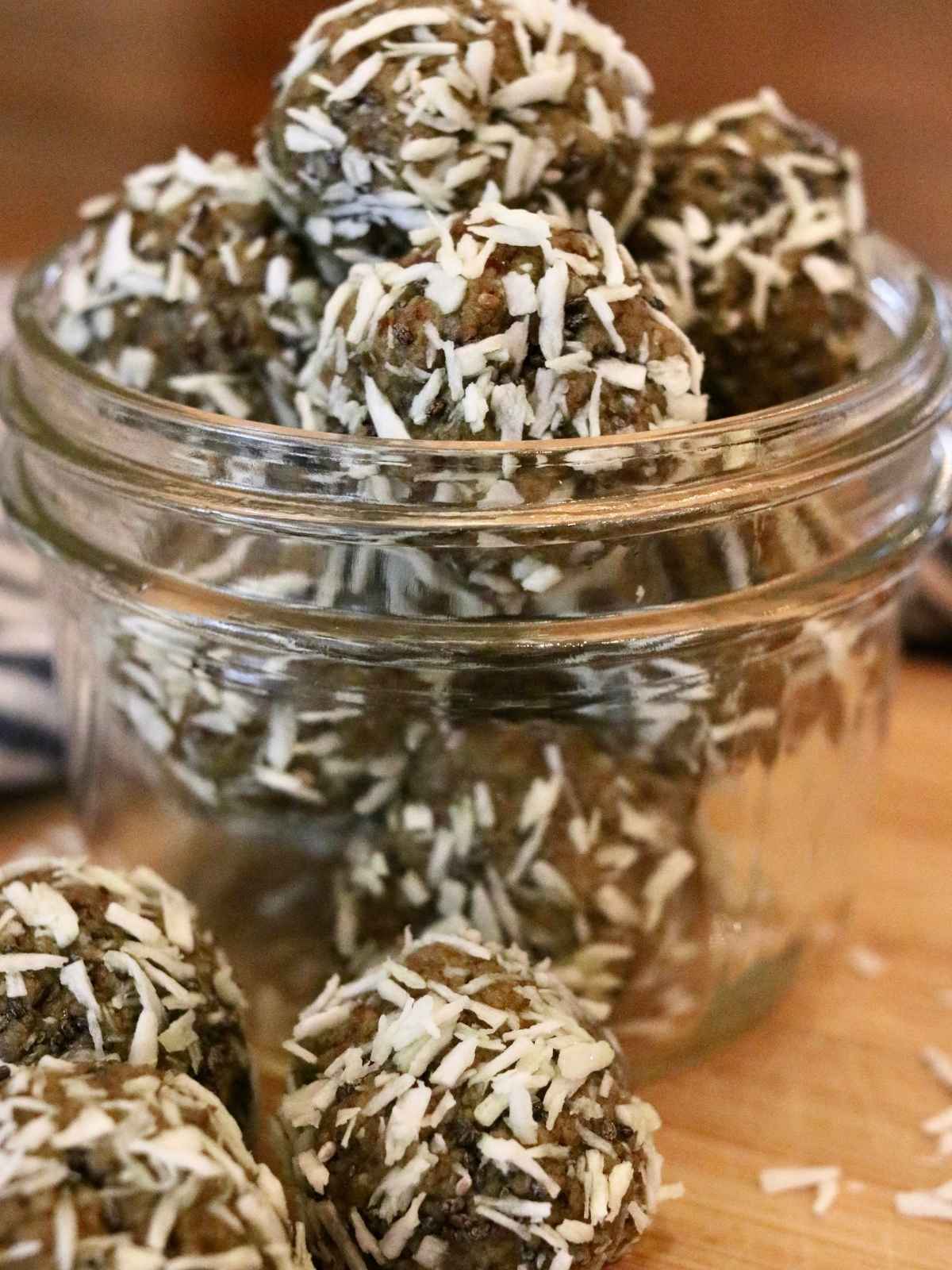 Jar filled with oat-free protein balls with dates.