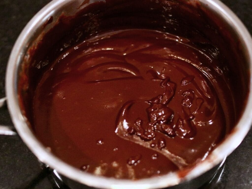 Melted chocolate mixture in a pan.