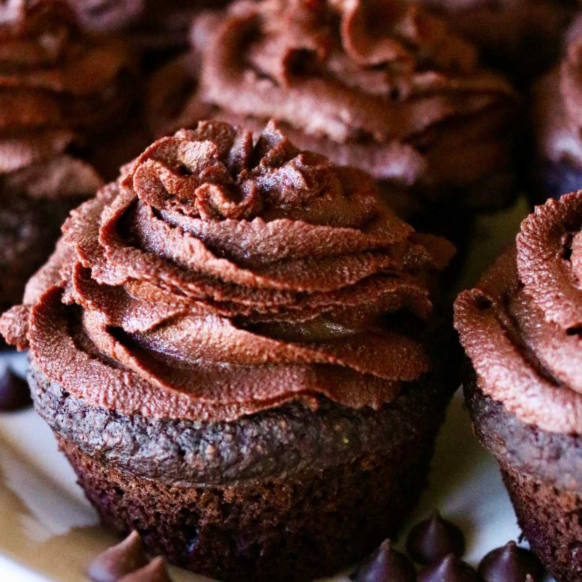 Vegan chocolate frosting on cupcakes.