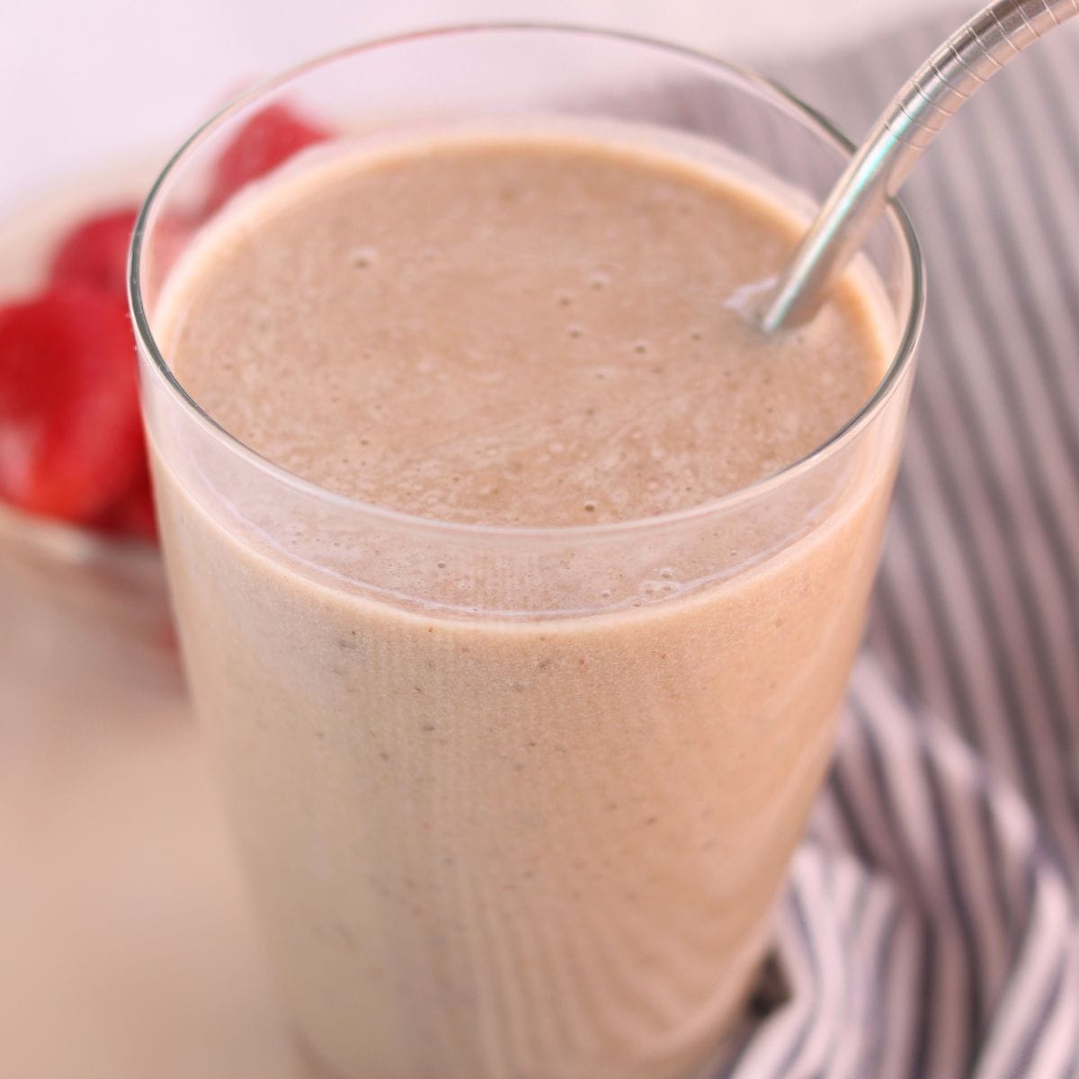 Closeup of ginger smoothie in a glass.