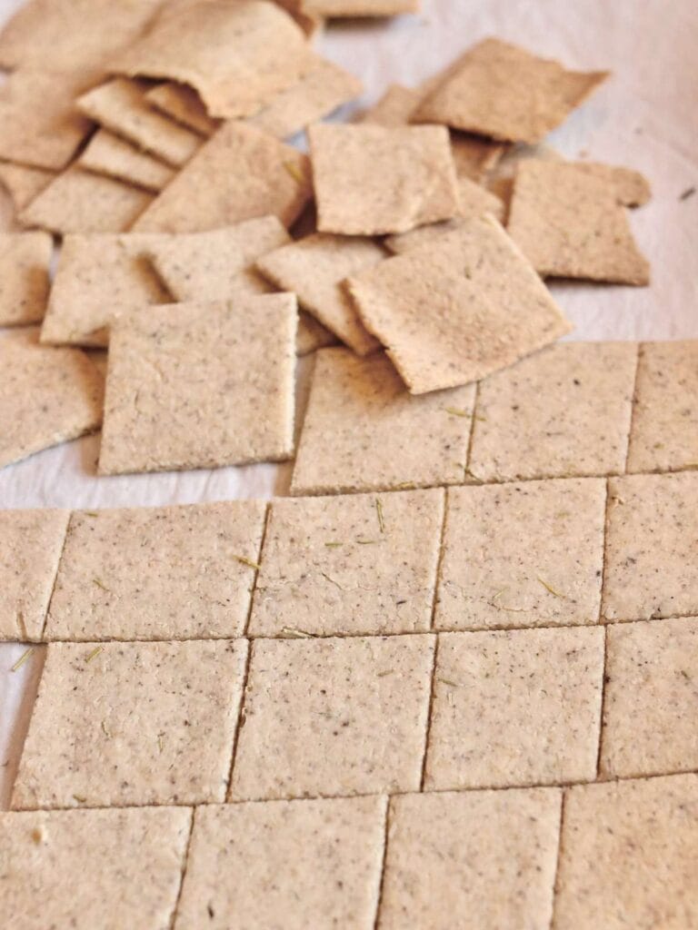 Almond flour crackers on parchment paper.