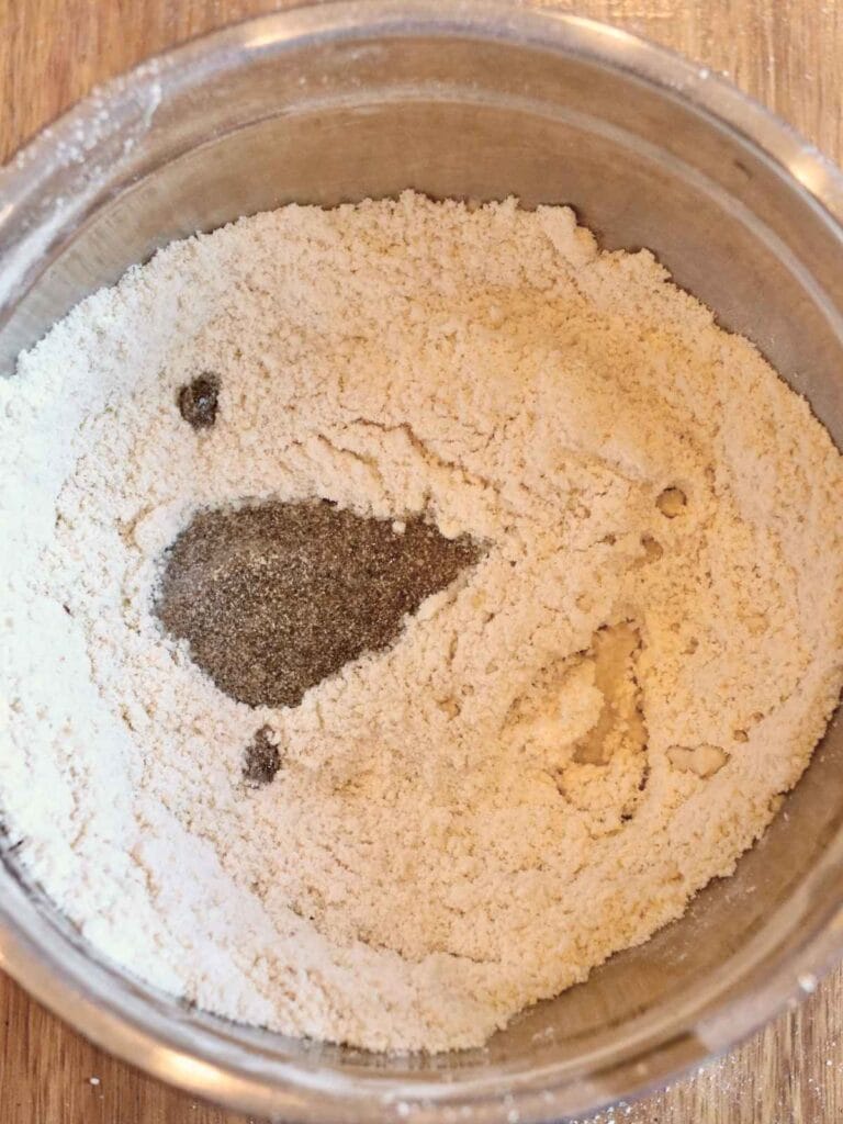 Chia egg and water in a bowl with dry ingredients.