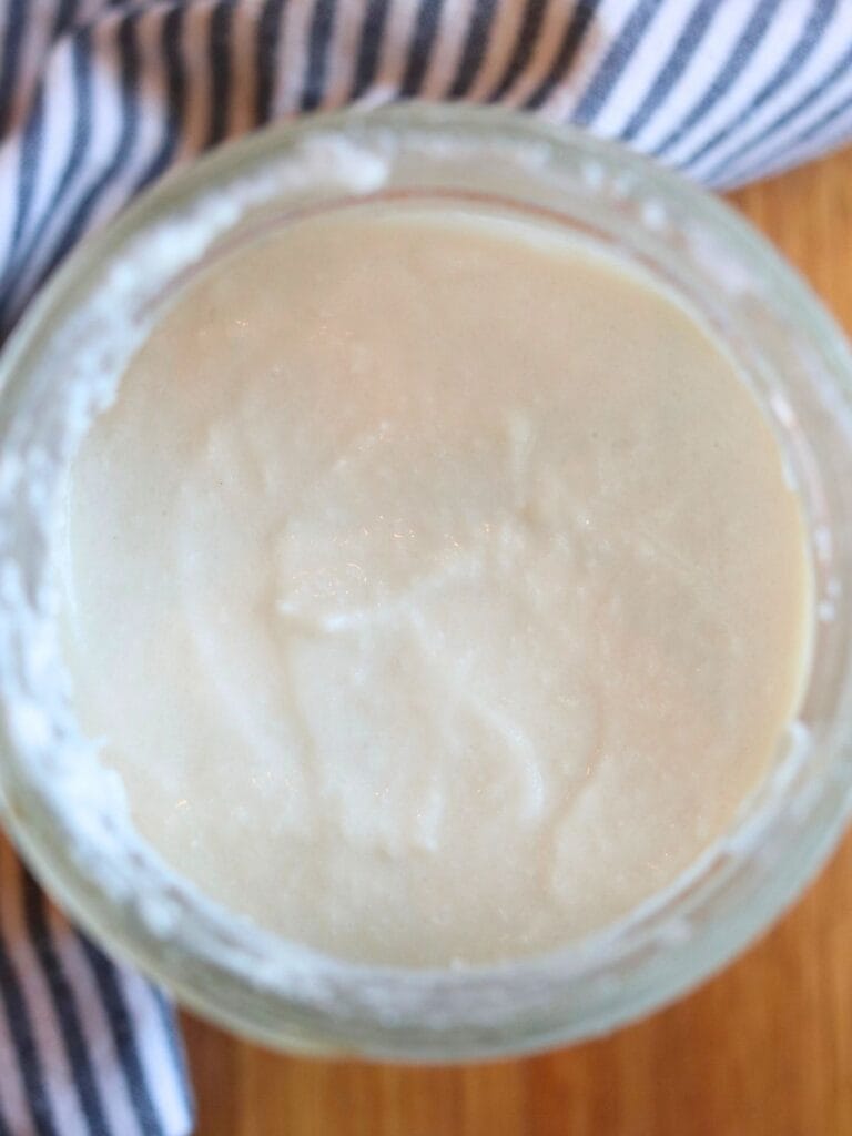 Top view of coconut yogurt in a mason jar.