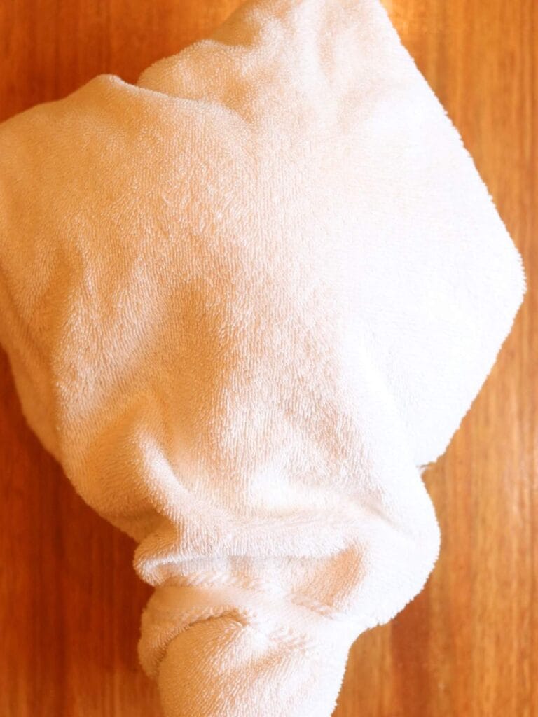 Pot wrapped in a towel.